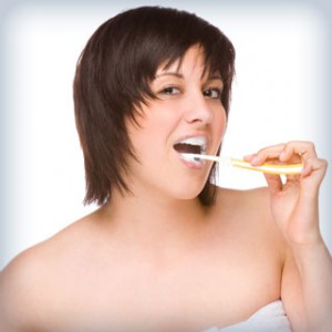 Woman brushing her teeth