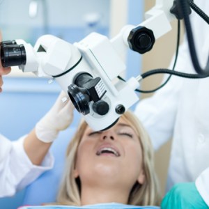 Dental patient under dental microscope